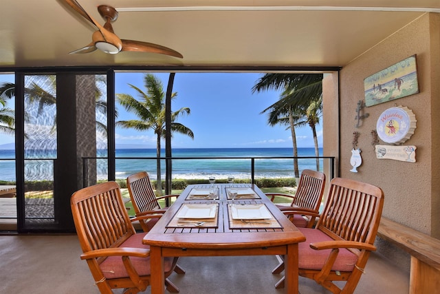 dining space featuring a water view