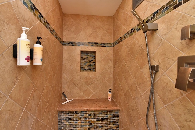 bathroom with tiled shower