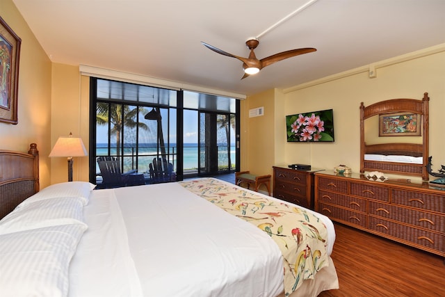 bedroom with hardwood / wood-style floors, access to outside, and ceiling fan