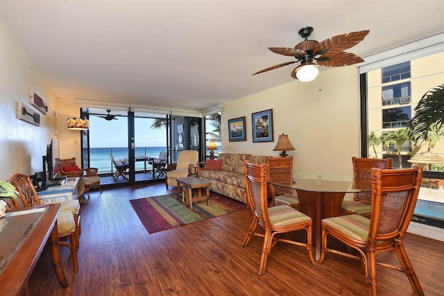 living room featuring hardwood / wood-style flooring, ceiling fan, and floor to ceiling windows