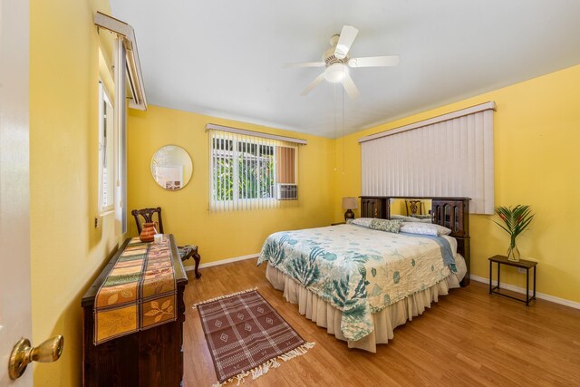 bedroom featuring wood-type flooring and ceiling fan