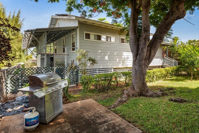 rear view of house with a lawn