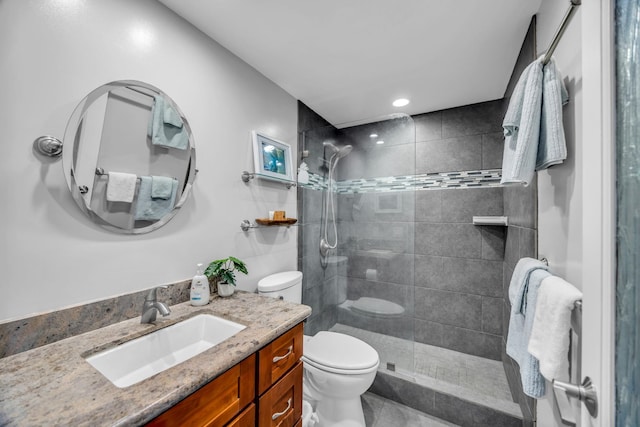 bathroom with walk in shower, toilet, vanity, tile patterned floors, and recessed lighting