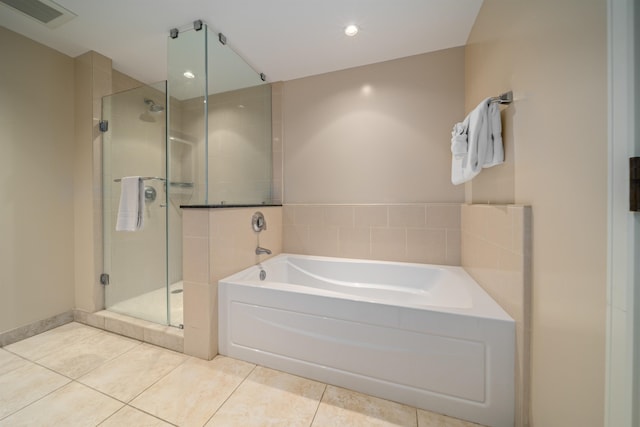 bathroom with tile patterned flooring and plus walk in shower