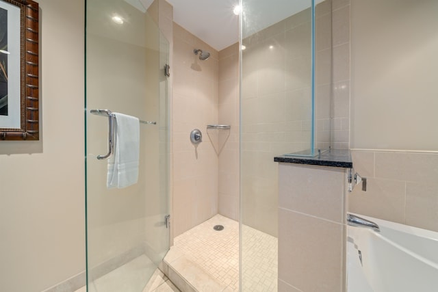 bathroom with a shower with door