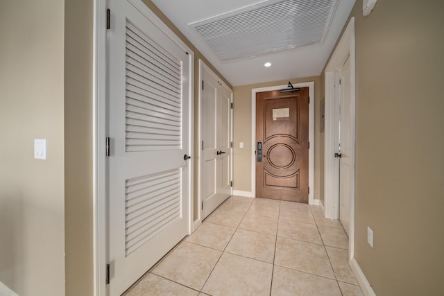 corridor with light tile patterned flooring