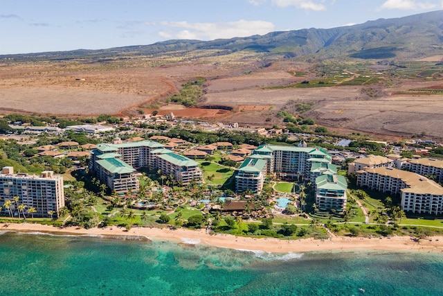 drone / aerial view featuring a water and mountain view