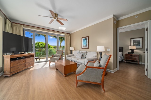 living room with ceiling fan, light wood-type flooring, and crown molding