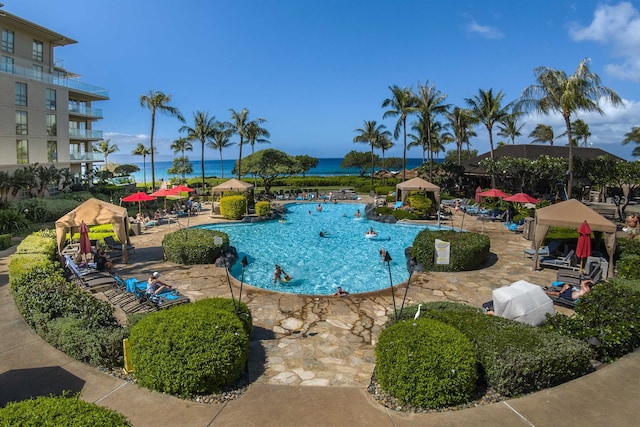 view of pool with a water view