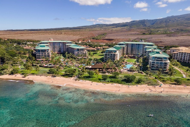 bird's eye view with a water and mountain view and a view of the beach