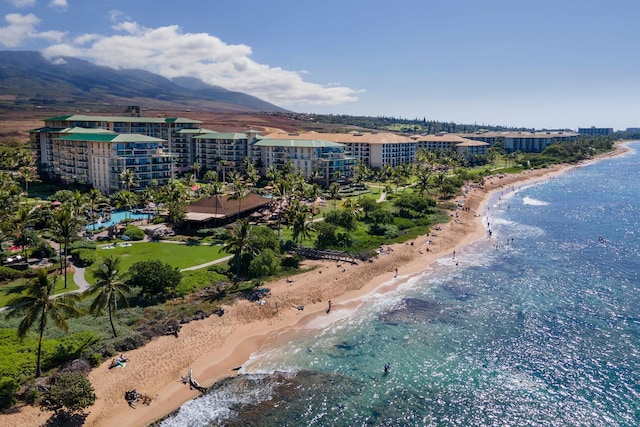 birds eye view of property with a view of the beach and a water and mountain view