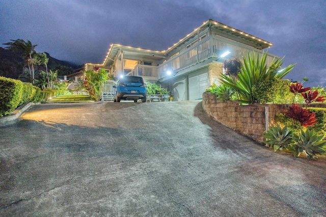 view of property exterior with driveway and a garage