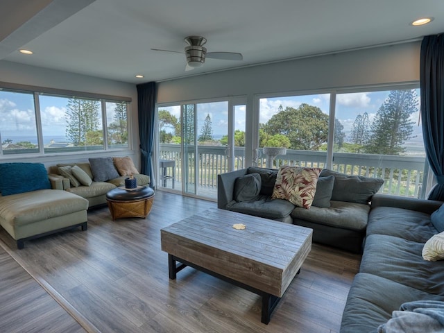 living room featuring wood finished floors, recessed lighting, and a ceiling fan