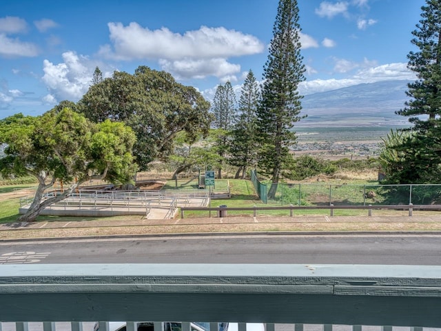 exterior space featuring fence and a mountain view