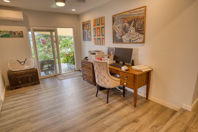 office area with baseboards, a wall unit AC, wood finished floors, and recessed lighting