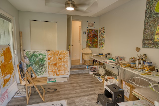 interior space with a ceiling fan and light wood-type flooring