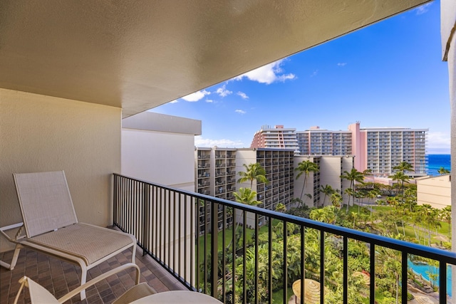 balcony featuring a view of city and a water view