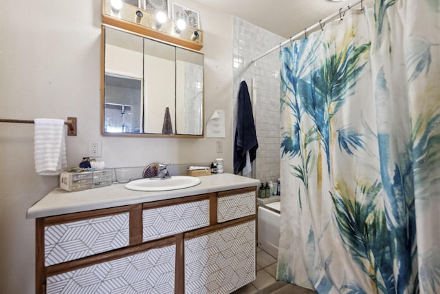 full bathroom with tile patterned flooring, shower / bath combo with shower curtain, and vanity