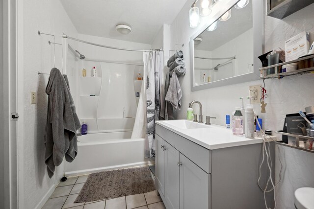 bathroom featuring toilet, shower / bathtub combination with curtain, vanity, and tile patterned floors