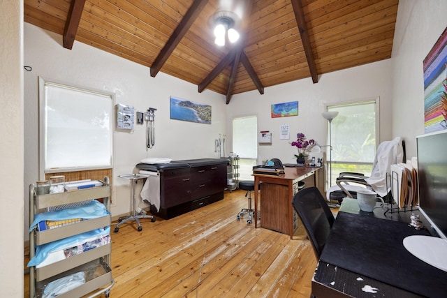 office space with light wood-style floors, wood ceiling, and vaulted ceiling with beams