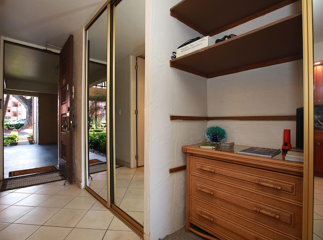 interior space with light tile patterned floors