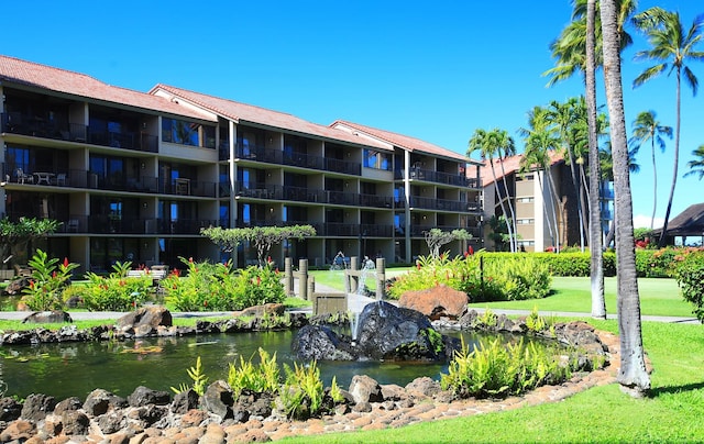 view of home's community with a water view