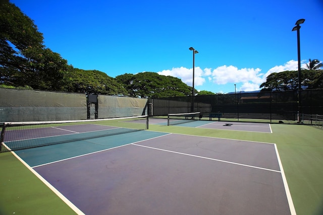 view of sport court featuring basketball hoop