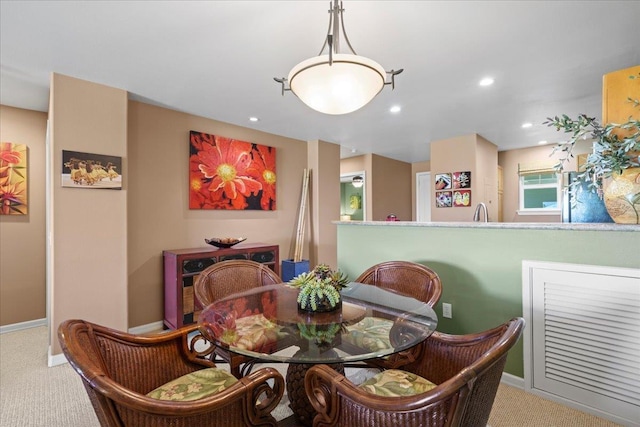 carpeted dining area with recessed lighting and baseboards