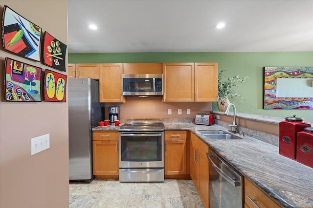 kitchen featuring recessed lighting, a sink, and stainless steel appliances