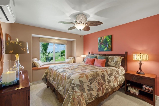 bedroom featuring an AC wall unit, a ceiling fan, baseboards, and carpet floors