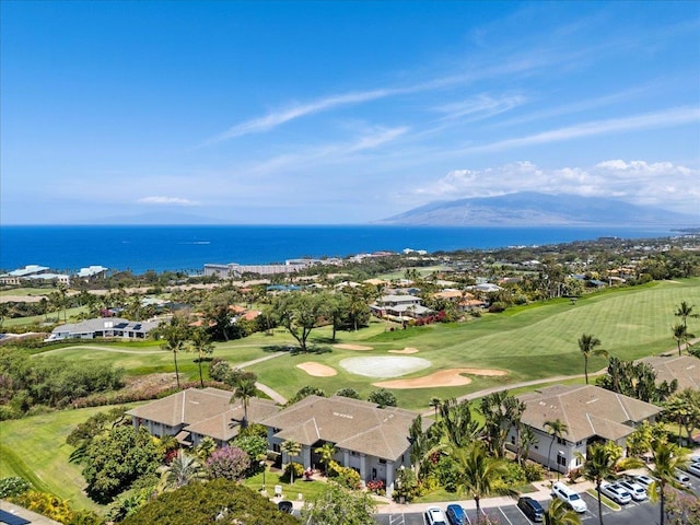 drone / aerial view with a residential view, golf course view, and a water and mountain view