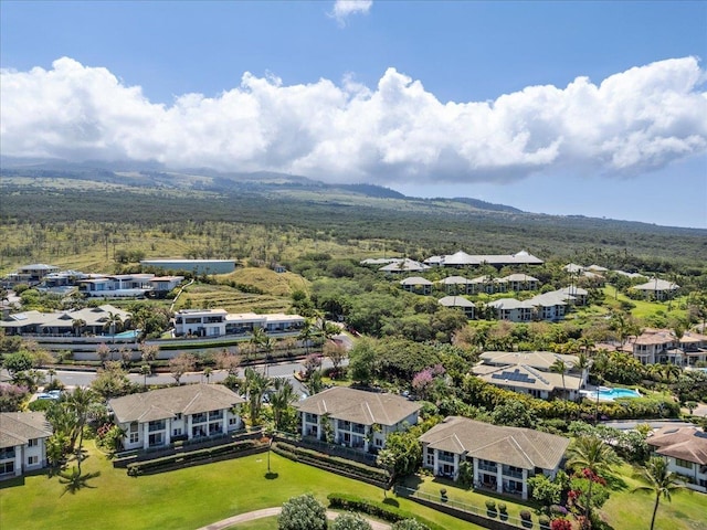 birds eye view of property featuring a mountain view, a residential view, and a forest view