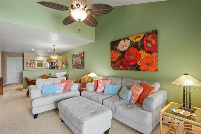 carpeted living room with a ceiling fan and recessed lighting