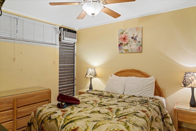 bedroom featuring ornamental molding, a ceiling fan, and a wall mounted AC