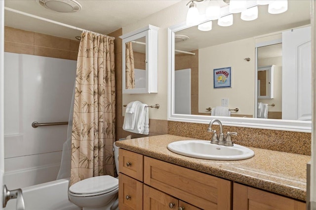 full bathroom featuring vanity, shower / bathtub combination with curtain, and toilet