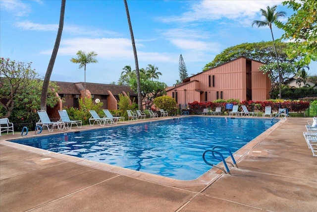 community pool with a patio area