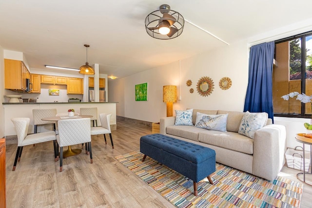 living room with light hardwood / wood-style flooring