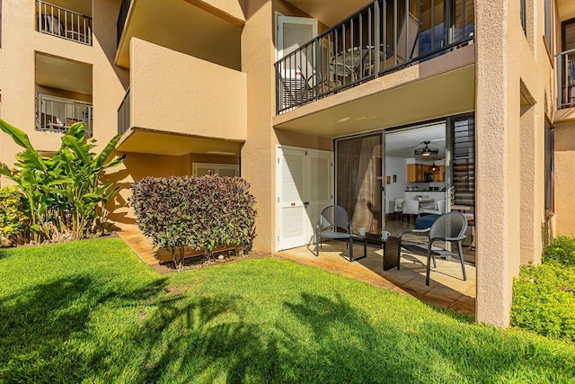 exterior space featuring a lawn and a patio area