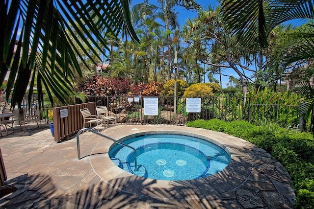 view of pool featuring a community hot tub and a patio