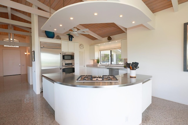 kitchen featuring built in appliances, lofted ceiling with beams, wood ceiling, and white cabinetry