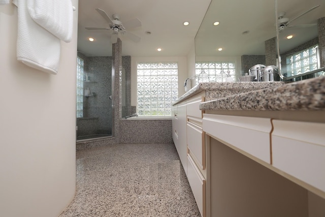 bathroom with a healthy amount of sunlight, a walk in shower, a ceiling fan, and recessed lighting