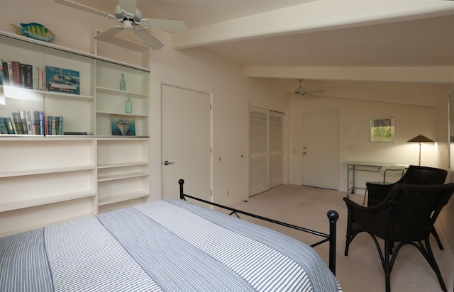 carpeted bedroom featuring vaulted ceiling with beams, ceiling fan, and a closet