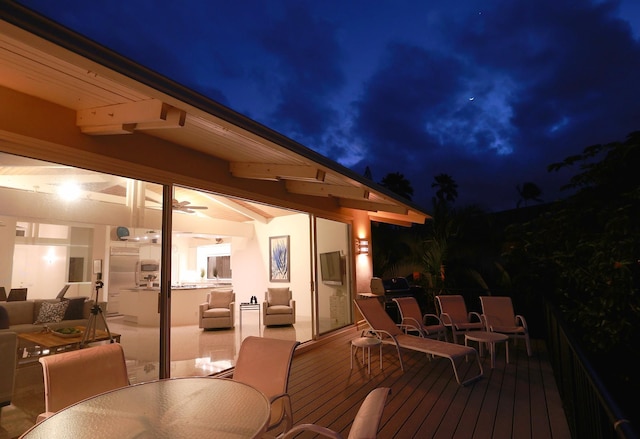 wooden terrace with outdoor dining area