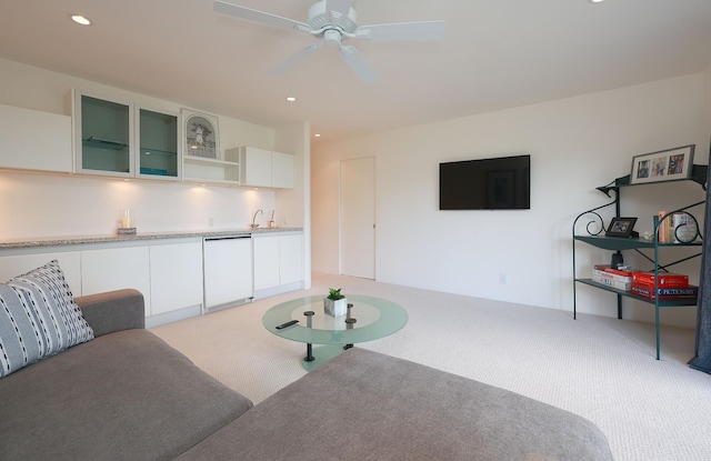 living area with light carpet, ceiling fan, wet bar, and recessed lighting