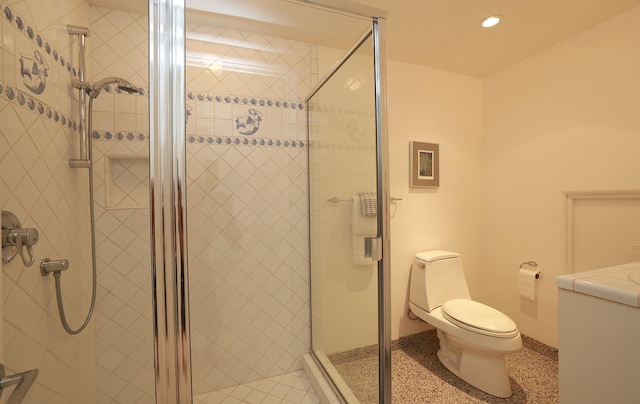 bathroom with toilet, a shower stall, speckled floor, and recessed lighting