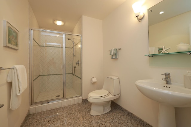 full bathroom with a sink, a shower stall, and toilet