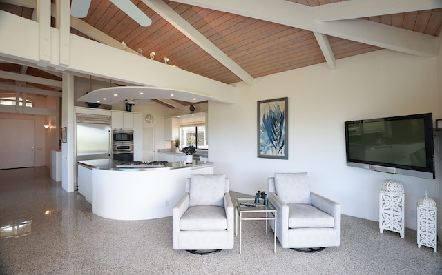 kitchen featuring lofted ceiling with beams, a kitchen island, wood ceiling, white cabinetry, and stainless steel gas stovetop