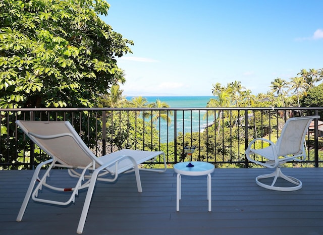 wooden deck featuring a water view