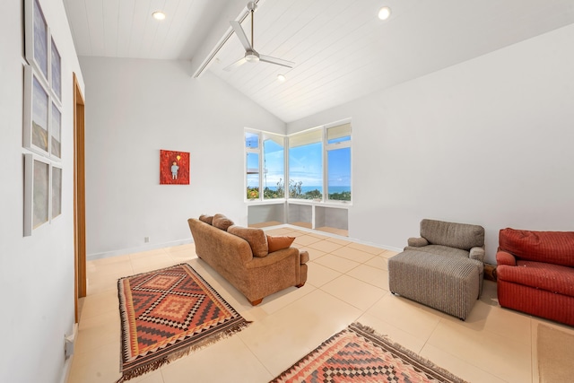 living room with vaulted ceiling with beams, ceiling fan, and tile patterned floors