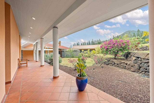 view of patio / terrace featuring a mountain view